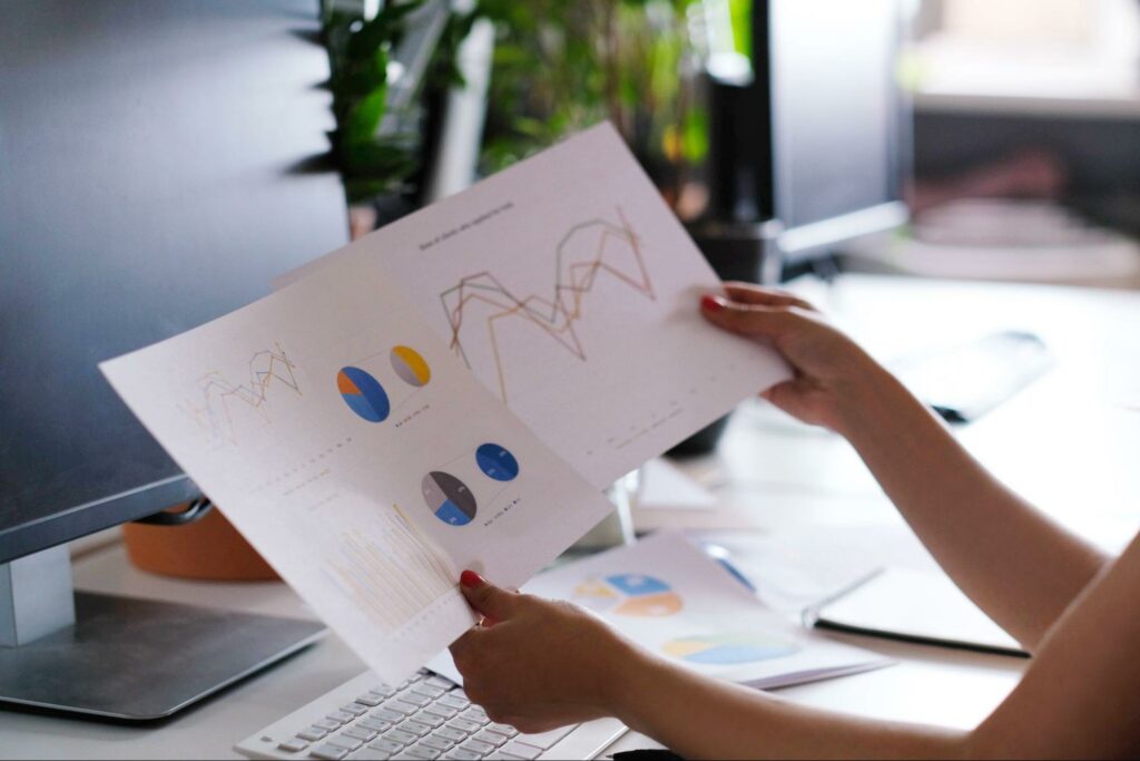 Analyzing data trends through reports and charts in a modern workspace.