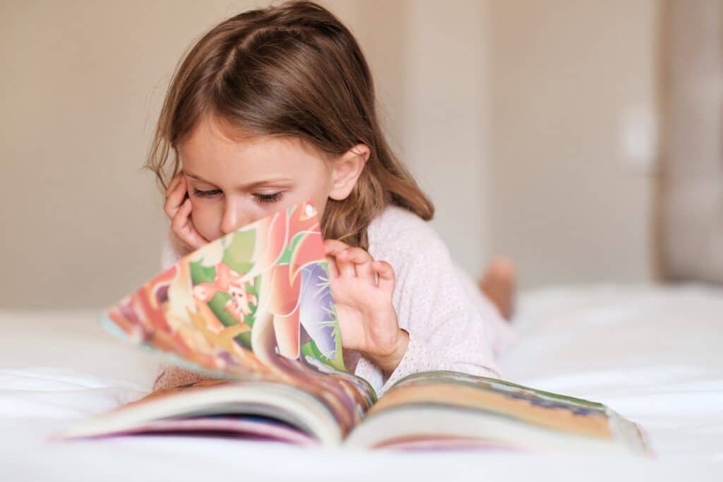 child reading a book at home