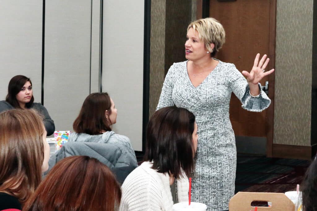 Kim Strobel at head of education workshop class