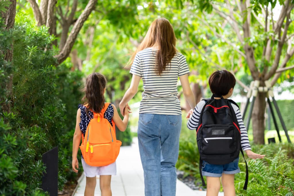 parent walking students home from school