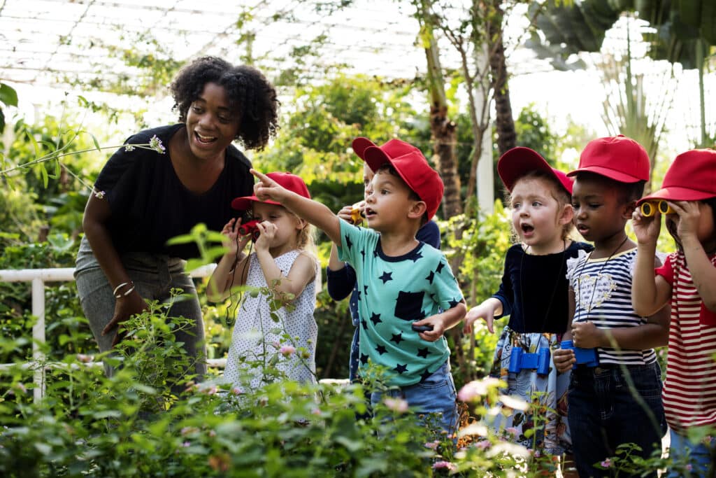 Teacher and kids school learning ecology gardening through project-based learning
