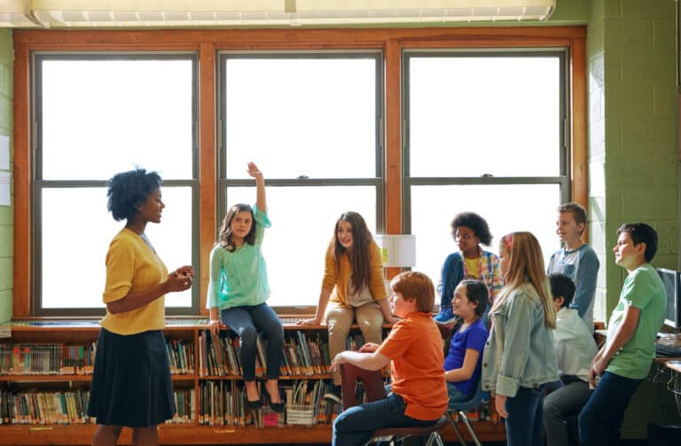 school climate concept a teacher with students in safe haven environment