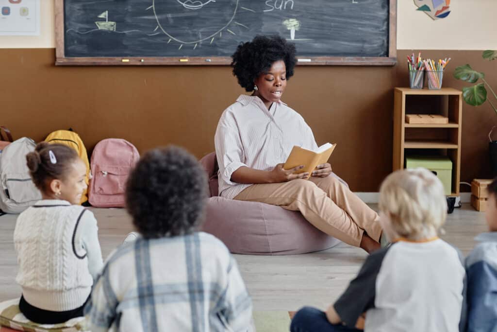 Young Children Listening to Story in Literature Class