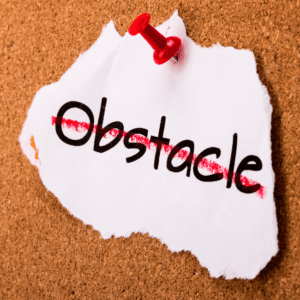 Word obstacle pinned on a cork board.