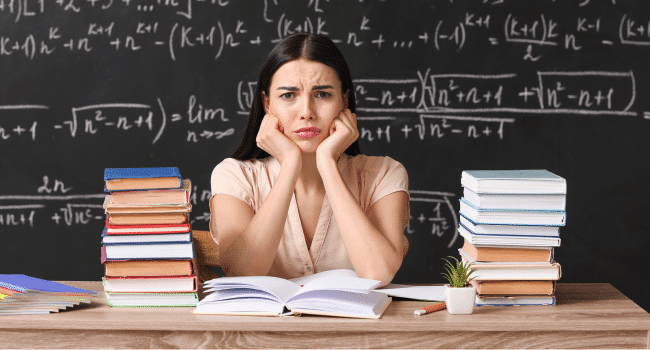 female teacher frowning looking tired