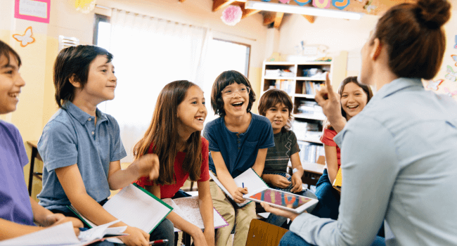 Teacher with her happy students.